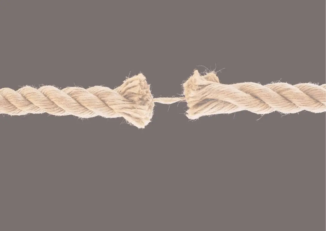 "Frayed rope nearly breaking apart, symbolising the separation and structural tension of an SMSF divorce split."